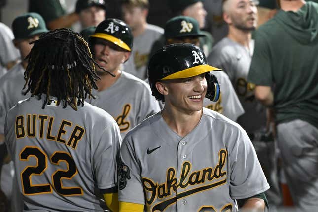 Aug 24, 2023; Chicago, Illinois, USA;  Oakland Athletics second baseman Zack Gelof (20) celebrates in the dugout after he hits a two run home run against the Chicago White Sox during the seventh inning at Guaranteed Rate Field.