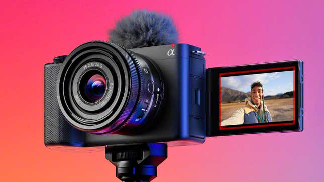 The Sony ZV-E1 connected  a tripod against a colorful background, with its LCD surface  flipped astir   to look   forwards and a vlogger successful  the wilderness pictured on-screen.