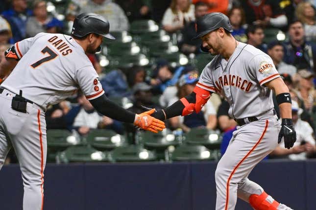 May 25, 2023; Milwaukee, Wisconsin, USA; San Francisco Giants right fielder Michael Conforto (8) is greeted by third baseman J.D. Davis (7) after hitting a solo home run in the eighth inning against the Milwaukee Brewers at American Family Field.