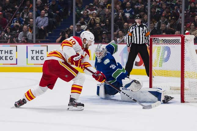 Mar 31, 2023; Vancouver, British Columbia, CAN; Vancouver Canucks goalie Thatcher Demko (35) makes a save on Calgary Flames forward Jonathan Huberdeau (10) during a penalty shot attempt in the second period at Rogers Arena.