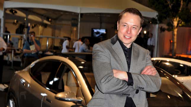Elon Musk stands in front of a Model S in 2009