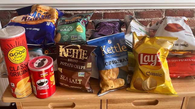 Several brands of supermarket potato chips on kitchen counter