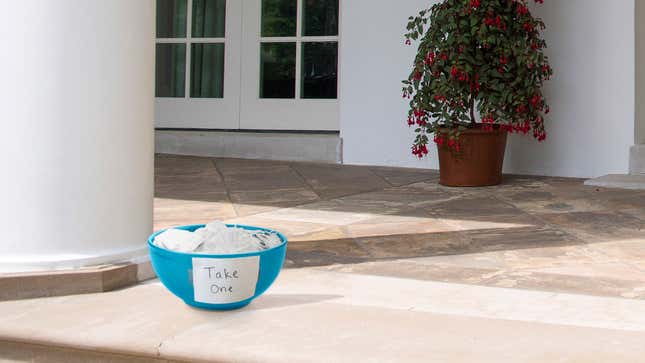 Image for article titled Sign Reading ‘Take One’ Placed On Bowl Of N95 Masks On White House Stoop