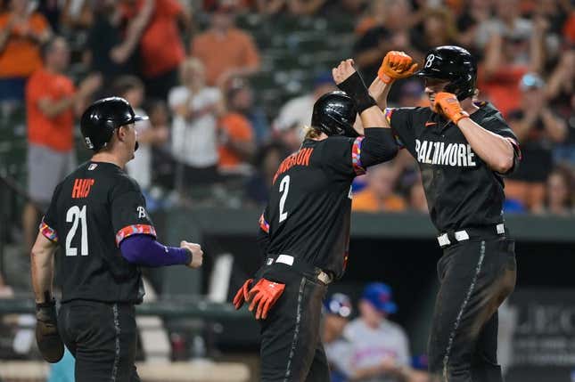 Aug 4, 2023; Baltimore, Maryland, USA; Baltimore Orioles second baseman Jordan Westburg (11) celebrates with third baseman Gunnar Henderson (2) and left fielder Austin Hays (21) after hitting a seventh inning three run home run against the New York Mets  at Oriole Park at Camden Yards.