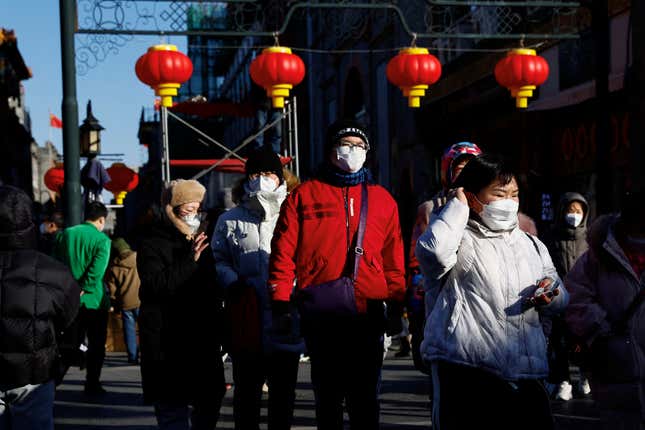 People walk past lanterns in Beijing, China.