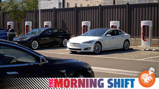Tesla vehicles are plugged into Tesla charging stations in a parking lot on September 22, 2022 in Santa Monica, California.