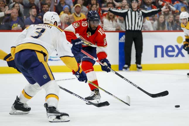 Mar 2, 2023; Sunrise, Florida, USA; Florida Panthers left wing Anthony Duclair (10) moves the puck as Nashville Predators defenseman Jeremy Lauzon (3) defends during the second period at FLA Live Arena.