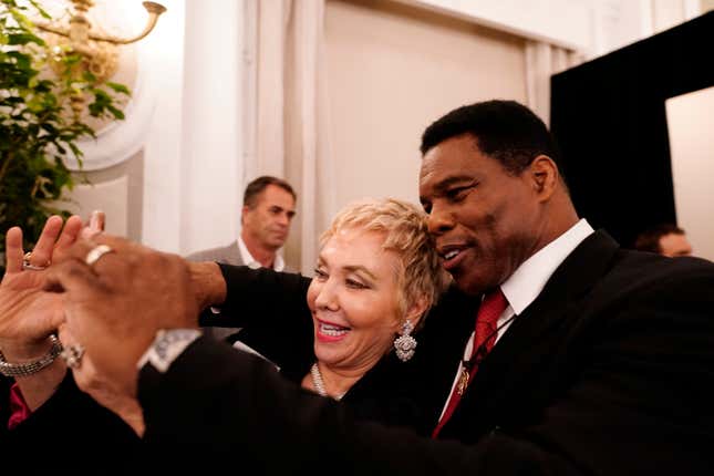 A supporter takes a photo with U.S. Senate candidate Herschel Walker during an election night watch party, Tuesday, May 24, 2022, in Atlanta. Walker won the Republican nomination for U.S. Senate in Georgia’s primary election.