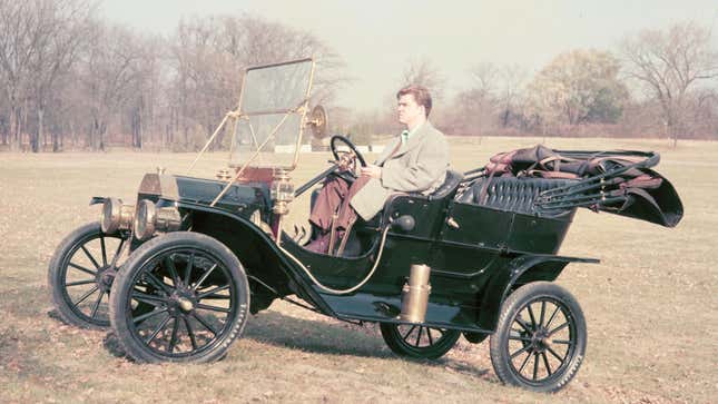 A photo of a green Model T Ford vintage car. 