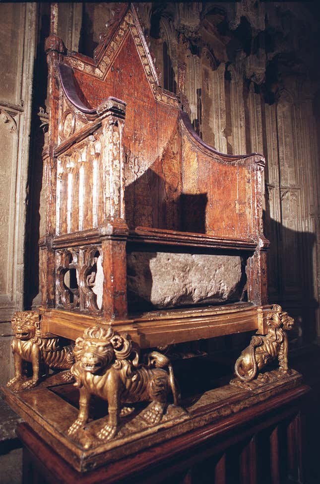 The ancient Stone of Scone beneath the Coronation Chair in London’s Westminster Abbey.