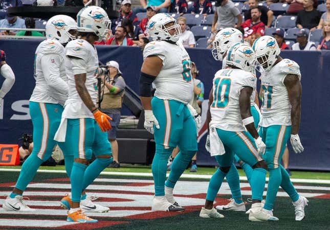 Aug 19, 2023; Houston, Texas, USA; Miami Dolphins wide receiver Tyreek Hill (10) celebrates running back Raheem Mostert (31) touchdown against the Houston Texans in the first quarter at NRG Stadium.