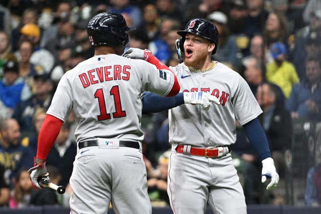 Apr 21, 2023; Milwaukee, Wisconsin, USA; Boston Red Sox right fielder Alex Verdugo (99) celebrates with Boston Red Sox third baseman Rafael Devers (11) after hitting a home run against the Milwaukee Brewers in the third inningat American Family Field.