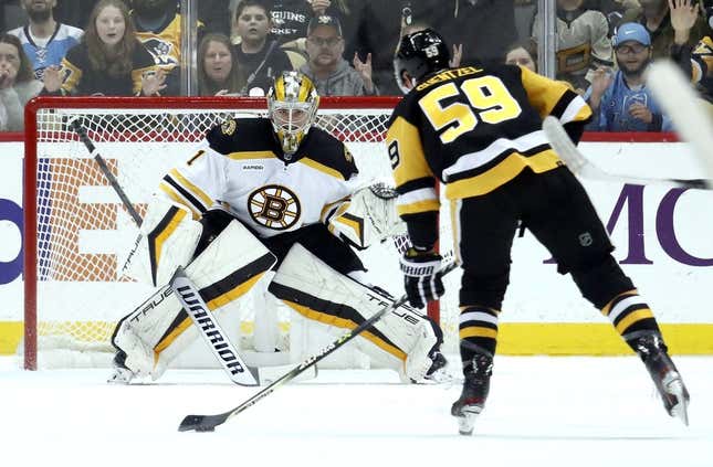 Apr 1, 2023; Pittsburgh, Pennsylvania, USA; Boston Bruins goaltender Jeremy Swayman (1) defends Pittsburgh Penguins left wing Jake Guentzel (59) during the first period at PPG Paints Arena.