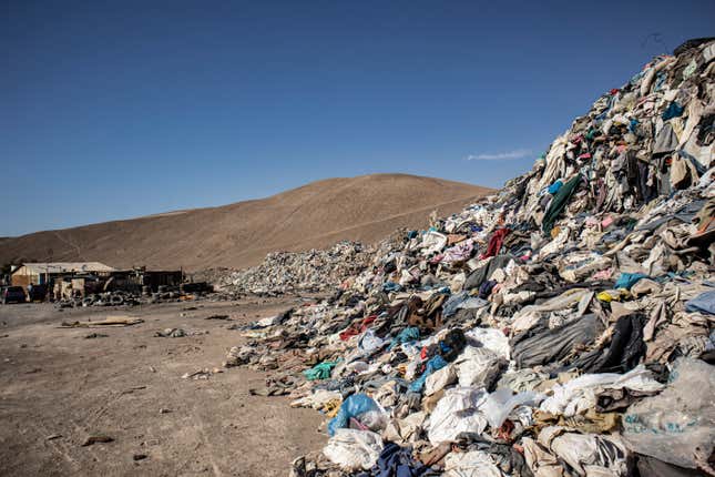 Clothes form a new dune in the desert outside of Iquique.