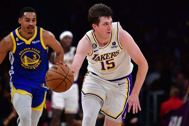 May 6, 2023; Los Angeles, California, USA; Los Angeles Lakers guard Austin Reaves (15) moves the ball ahead of Golden State Warriors guard Jordan Poole (3) during the first half in game three of the 2023 NBA playoffs at Crypto.com Arena.