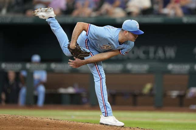 Jul 16, 2023; Arlington, Texas, USA; Texas Rangers starting pitcher Cody Bradford (61) follows through on his pitch to the Cleveland Guardians during the sixth inning at Globe Life Field.
