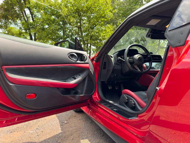 Door open and interior image of red 2023 Nissan Z