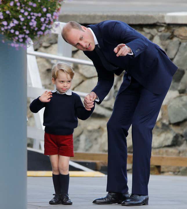 Britain's Prince George waves while holding the hand of Prince William as they prepare to board a floatplane for their official departure from Canada in Victoria, British Columbia, Canada, October 1, 2016. REUTERS/Chris Wattie - RTSQD09