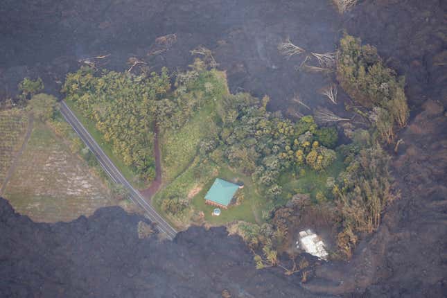 Image for article titled New aerial photos show Kilauea’s lava devouring neighborhoods