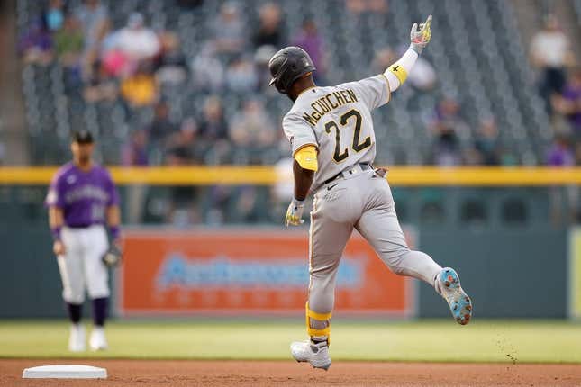 Apr 17, 2023; Denver, Colorado, USA; Pittsburgh Pirates designated hitter Andrew McCutchen (22) raises his hand as he rounds the bases on a solo home run in the first inning against the Colorado Rockies at Coors Field.