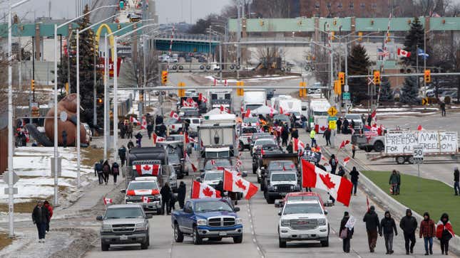 WINDSOR, ON - February 10: Protestors and supporters set up at a blockade at the foot of the Ambassador Bridge, sealing off the flow of commercial traffic over the bridge into Canada from Detroit, on February 10, 2022 in Windsor, Canada. As a convoy of truckers and supporters continues to occupy Ottawas downtown, blockades and convoys have popped up around the country in support of the protest against Canada’s COVID-19 vaccine mandate for cross-border truckers. 
