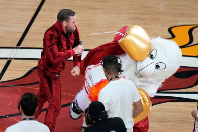 This poor schlub doesn’t get paid enough. (The one in the costume, not McGregor.)