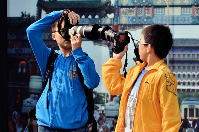 boys taking photos together