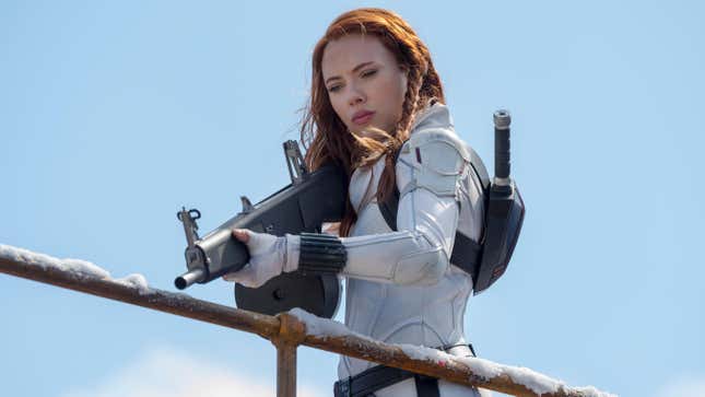 Scarlett Johansson's Black Widow wears her white superhero suit while holding a machine gun in her recent solo film.