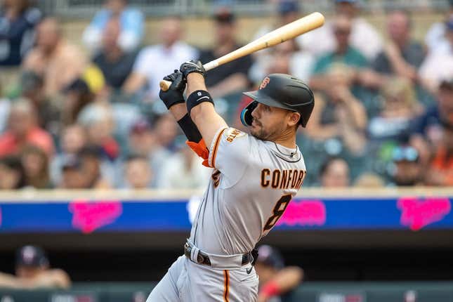 May 22, 2023; Minneapolis, Minnesota, USA; San Francisco Giants right fielder Michael Conforto (8) hits a three-run home run in the first inning against the Minnesota Twins at Target Field.