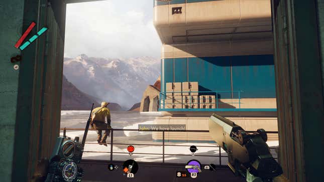 A view of someone sitting on the railing overlooking the water near Harriet's hangar.