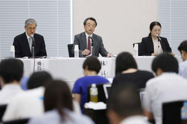 Lawyer and former prosecutor Makoto Hayashi, center, speaks during a news conference in Tokyo Tuesday, Aug. 29, 2023. The investigative team set up by a powerful Japanese boys-band agency at the center of sexual abuse allegations recommended Tuesday the chief executive resign to take responsibility. Hayashi who heads the investigation, said the team is also recommending financial compensation for those who have, and will, come forward. (Kyodo News via AP)