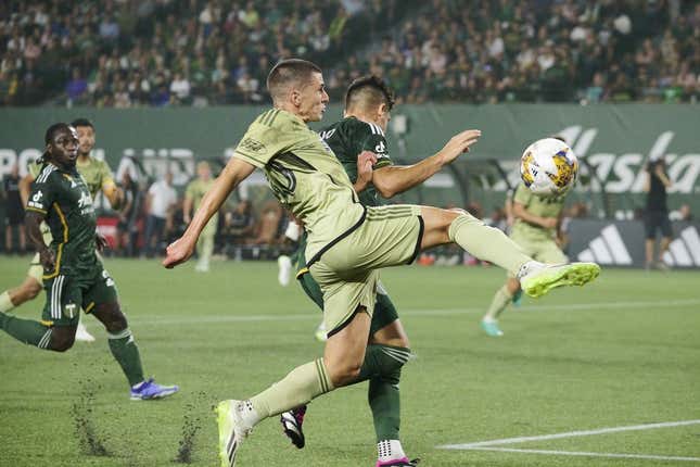 Sep 9, 2023; Portland, Oregon, USA; Los Angeles FC defender Sergi Palencia (30) takes a shot on goal during the first half against Portland Timbers defender Claudio Bravo (5) at Providence Park.