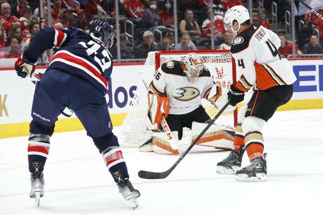 Feb 23, 2023; Washington, District of Columbia, USA; Anaheim Ducks goaltender John Gibson (36) makes a save on Washington Capitals right wing Tom Wilson (43) as Ducks defenseman Cam Fowler (4) defends in the first period at Capital One Arena.