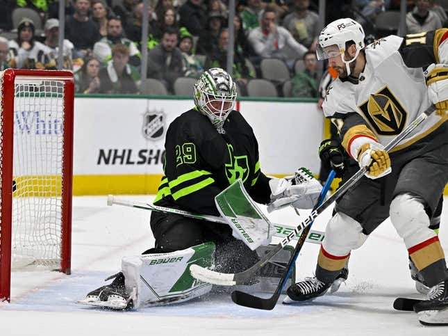 Apr 8, 2023; Dallas, Texas, USA; Dallas Stars goaltender Jake Oettinger (29) turns aside a shot by Vegas Golden Knights center Nicolas Roy (10) during the first period at the American Airlines Center.