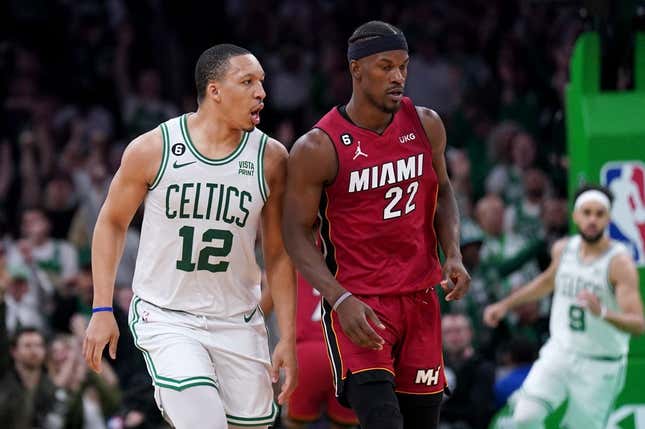 May 19, 2023; Boston, Massachusetts, USA; Boston Celtics forward Grant Williams (12) and Miami Heat forward Jimmy Butler (22) react after a play during the second half of game two of the Eastern Conference Finals for the 2023 NBA playoffs at TD Garden.