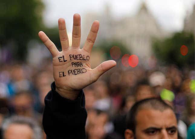 A protester with “the people for the people” written on his hand.