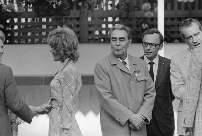 Soviet premier Leonid Brezhnev casts an admiring gaze at film actress Jill St. John at a pool party given by Richard Nixon.