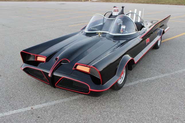 1960s Batmobile parked in a parking lot.