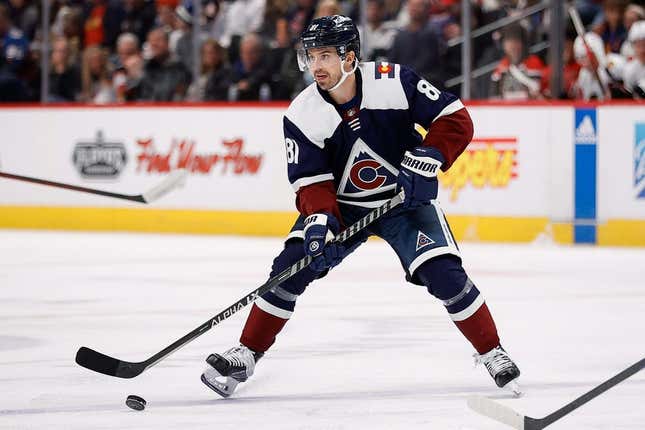 Mar 20, 2023; Denver, Colorado, USA; Colorado Avalanche center Denis Malgin (81) controls the puck in the second period against the Chicago Blackhawks at Ball Arena.