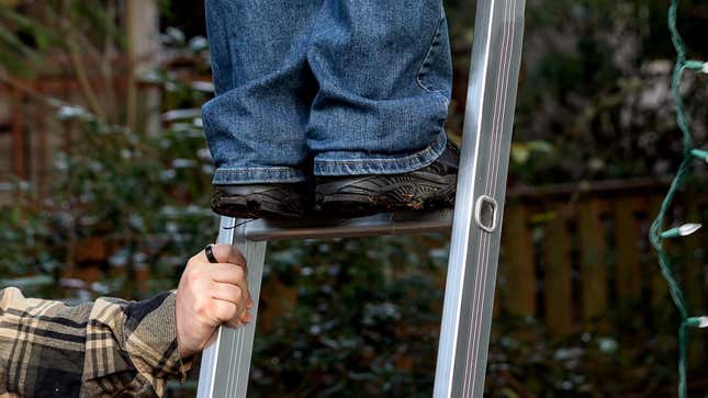 Image for article titled ‘It Would Be So Easy,’ Think 79% Of People Holding Ladders For Loved Ones Putting Up Christmas Lights