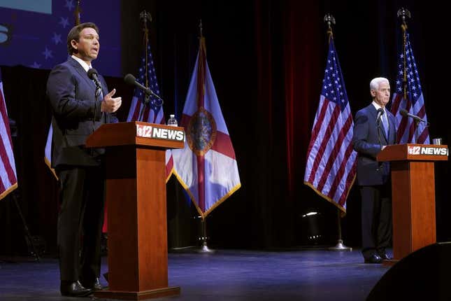 Florida’s Republican Gov. Ron DeSantis left, speaks during a debate with his Democratic opponent Charlie Crist in Fort Pierce, Fla., Monday, Oct. 24, 2022