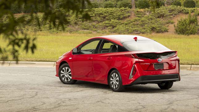 A photo of a red Toyota Prius hybrid car. 