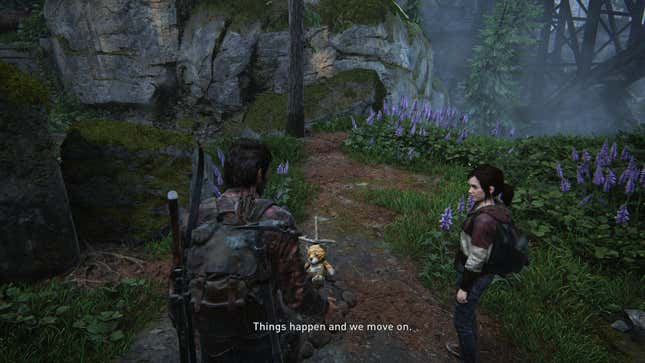 A screenshot from the game The Last of Us shows Joel and Ellie standing near a grave marked by a teddy bear, as Joel says "Things happen and we move on."