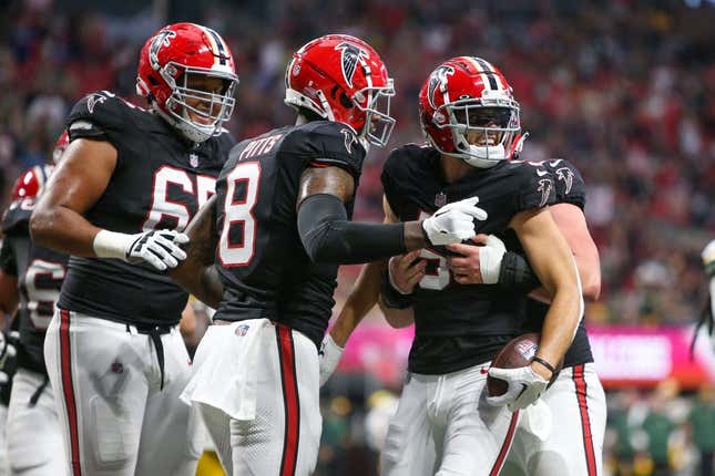 Sep 17, 2023; Atlanta, Georgia, USA; Atlanta Falcons wide receiver Drake London (5) celebrates after a touchdown catch with tight end Kyle Pitts (8) against the Green Bay Packers in the second quarter at Mercedes-Benz Stadium.
