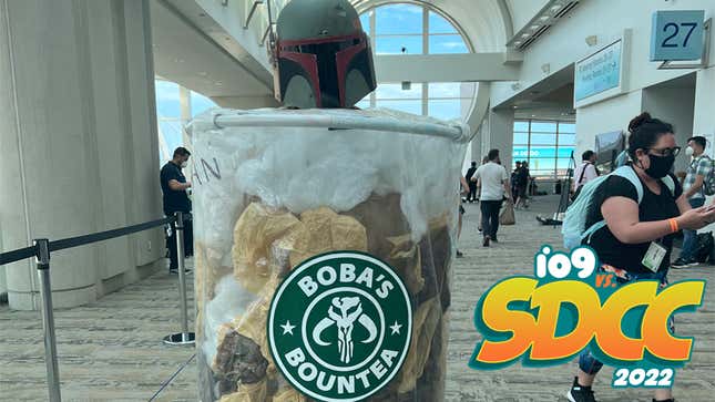 A cosplayer dressed as Boba Fett, encased in a Starbucks cup filled with Boba tea.