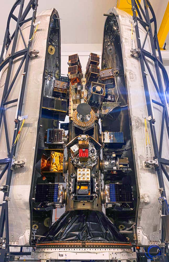 Satellites are stacked inside the payload fairing of the SpaceX Falcon 9 rocket ahead of the Transporter-8 mission.