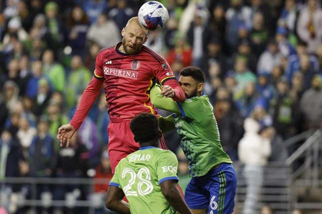 Apr 8, 2023; Seattle, Washington, USA; St. Louis City forward Klauss (9) heads the ball against Seattle Sounders midfielder Joao Paulo (6) during the second half at Lumen Field.