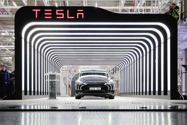 A new Tesla car is seen during the official opening of the new Tesla electric car manufacturing plant on March 22, 2022 near Gruenheide, Germany. 