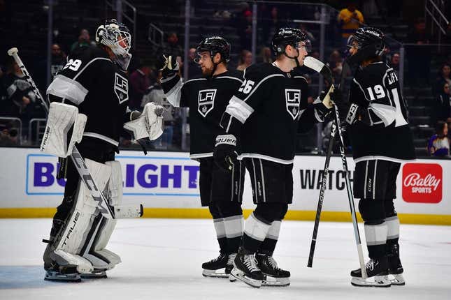 Mar 16, 2023; Los Angeles, California, USA; Los Angeles Kings goaltender Pheonix Copley (29) right wing Viktor Arvidsson (33) defenseman Sean Walker (26) and left wing Alex Iafallo (19) celebrate the victory against the Columbus Blue Jackets at Crypto.com Arena.