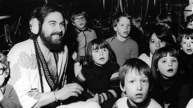 Evangalos Papathanassiou, better known as Vangelis, records a song with a group of children.